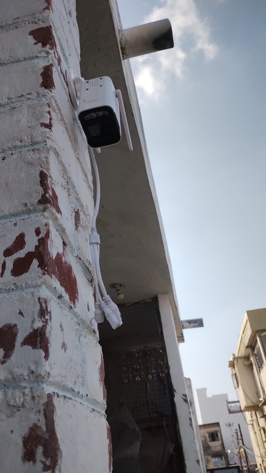 Outdoor security camera installed on an exterior wall, CCTV service example